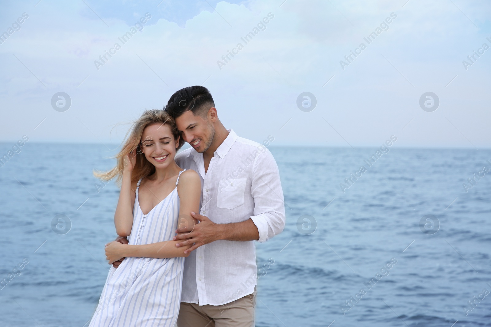 Photo of Happy couple on beach, space for text. Romantic walk