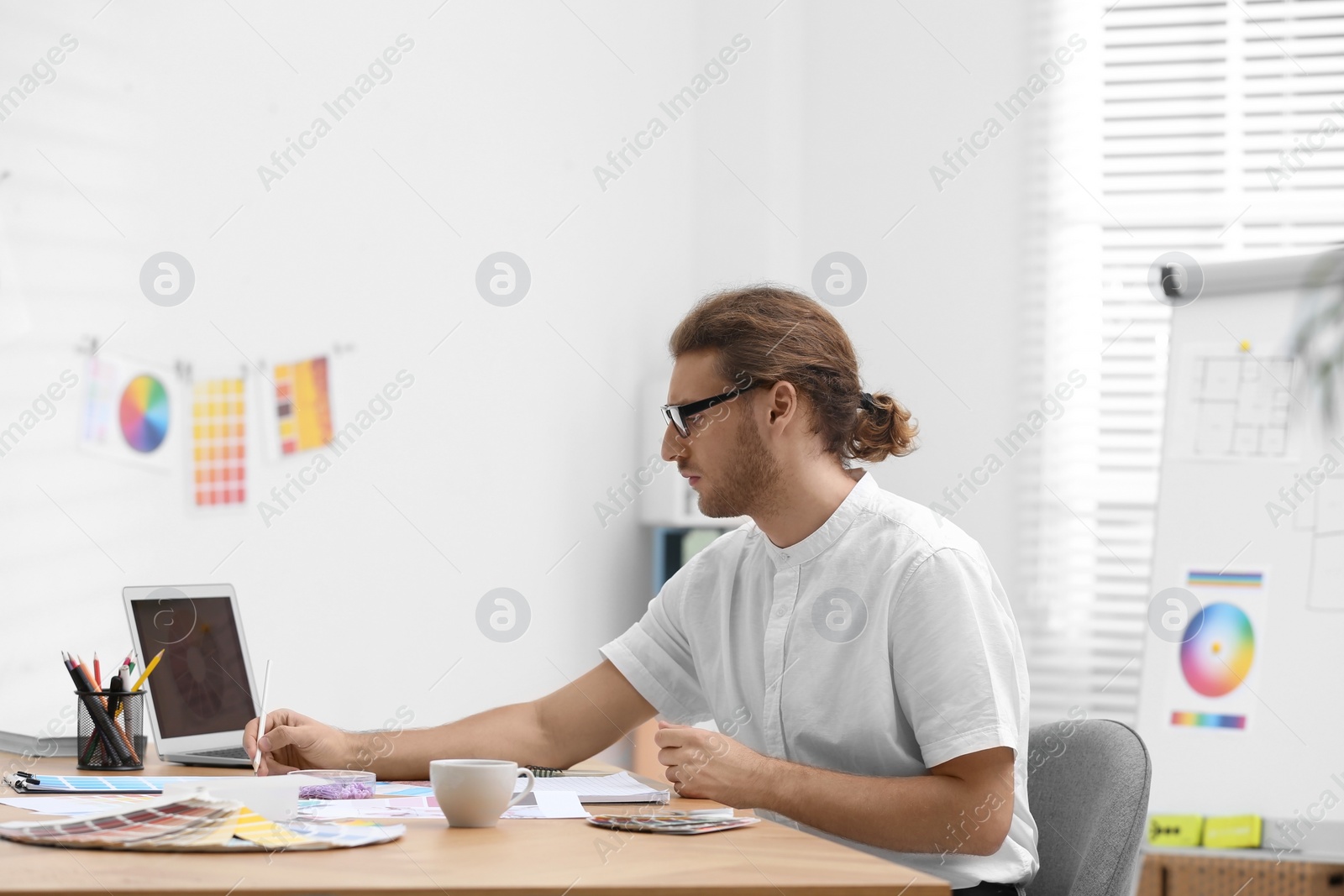 Photo of Professional interior designer at workplace in office