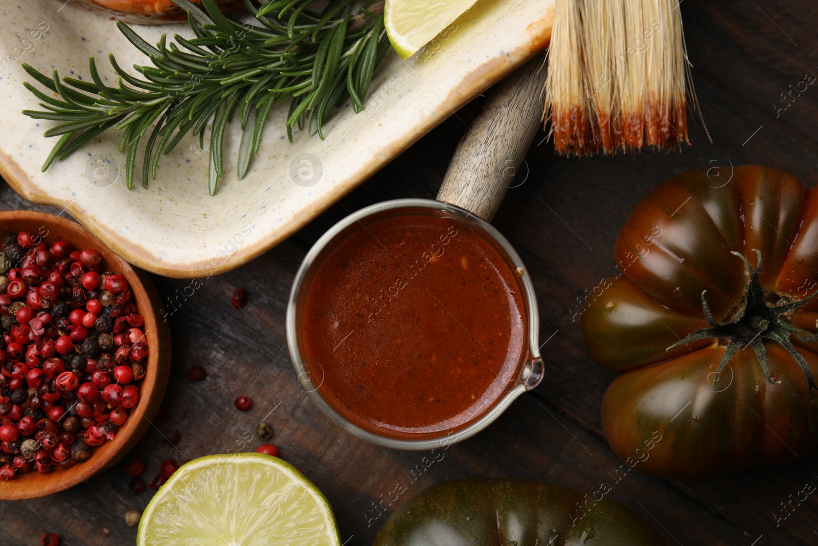 Photo of Fresh marinade, fish and other products on wooden table, flat lay