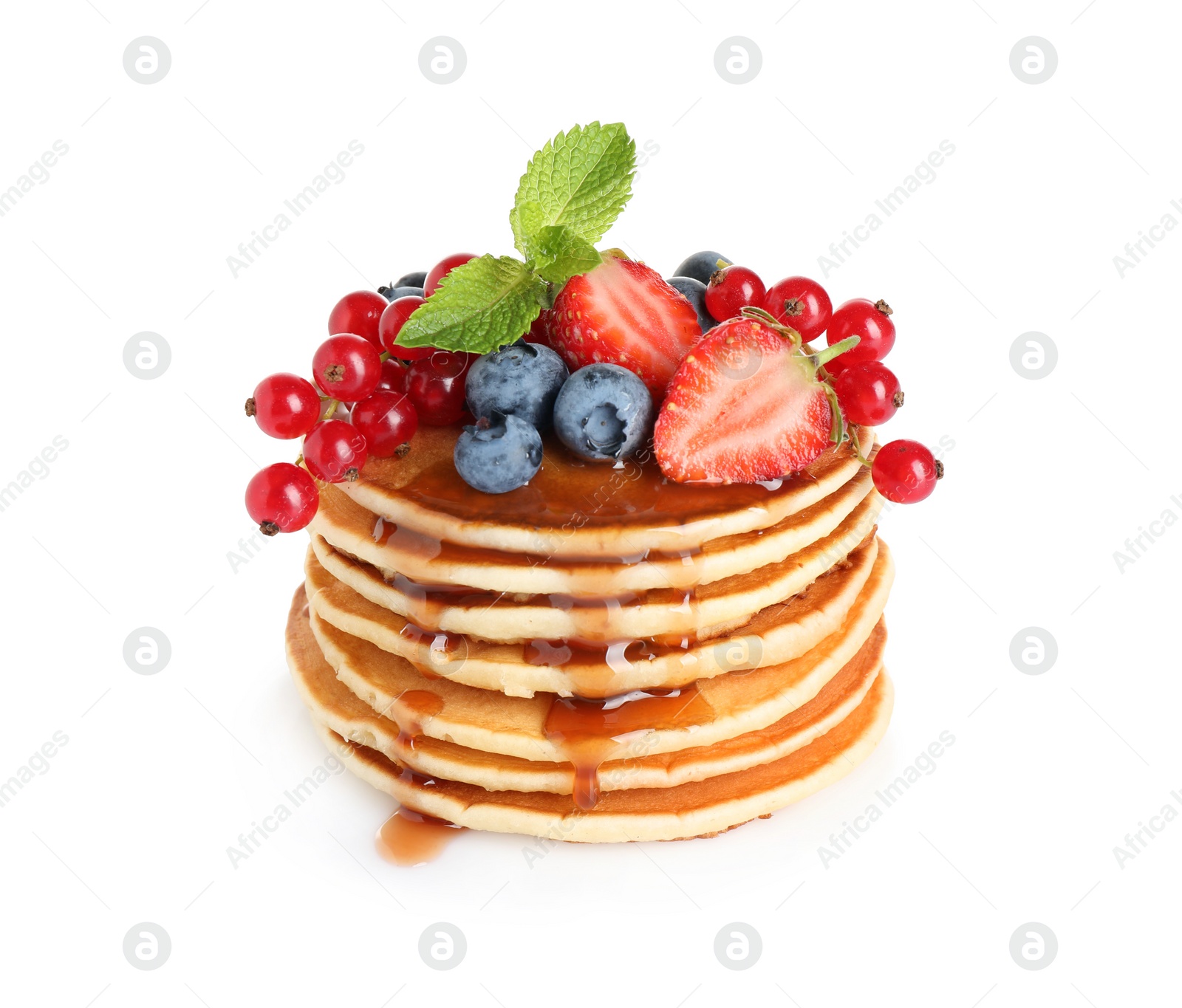 Photo of Stack of delicious pancakes with fresh berries and syrup on white background