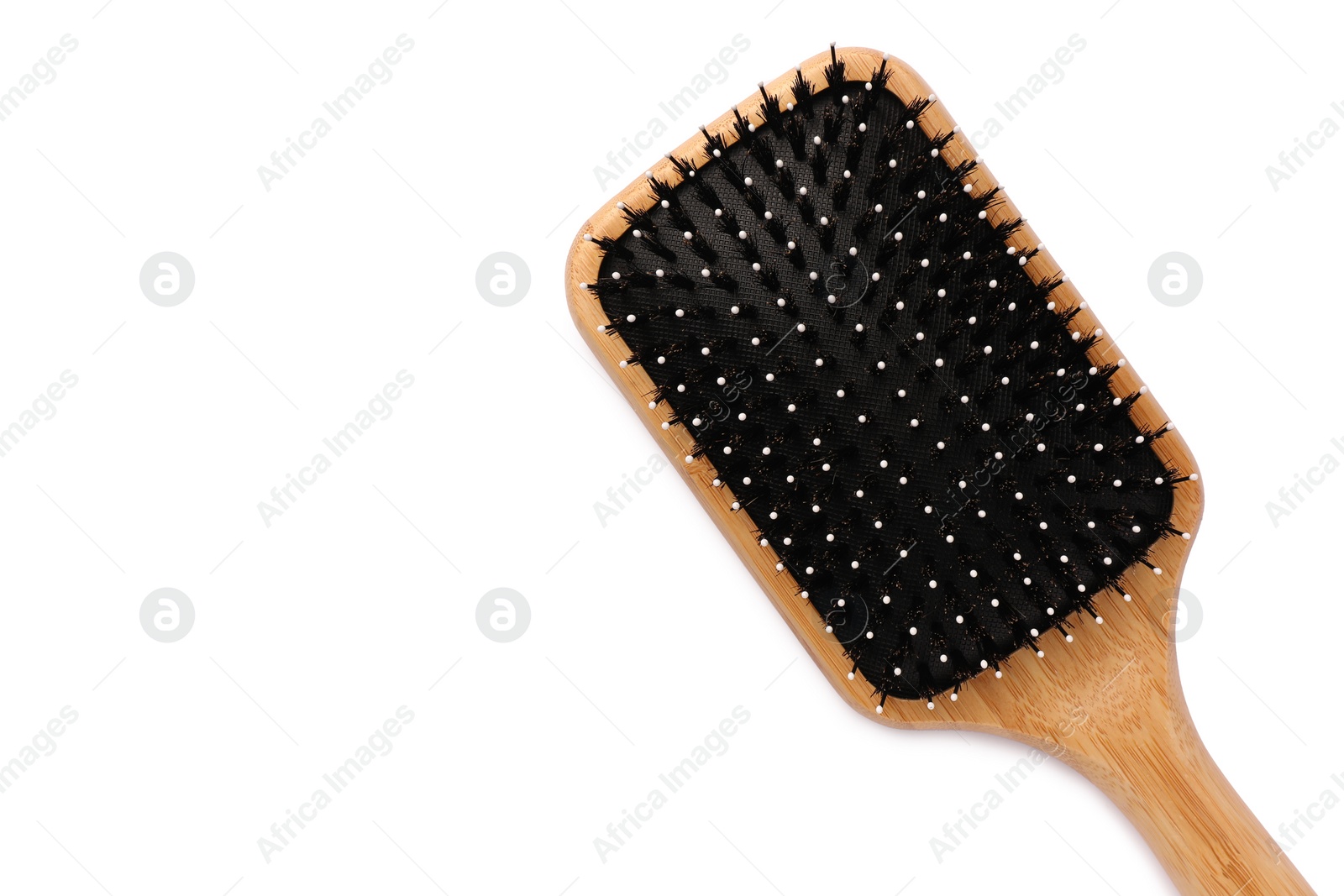 Photo of New wooden hair brush isolated on white, top view