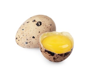 Photo of Whole and cracked quail eggs on white background