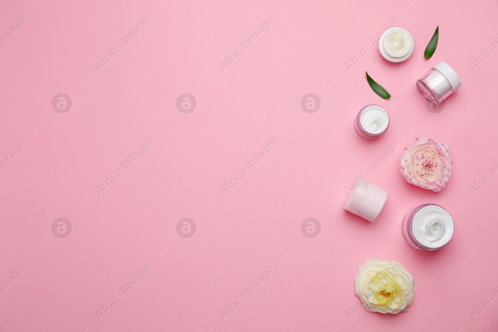 Photo of Flat lay composition with cosmetic products on color background