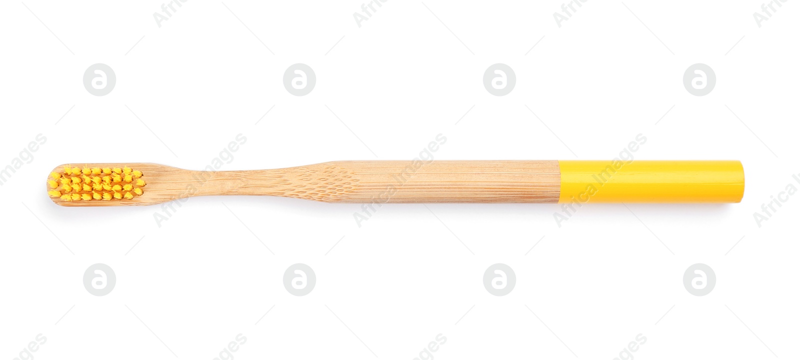 Photo of Bamboo toothbrush with yellow bristle isolated on white, top view