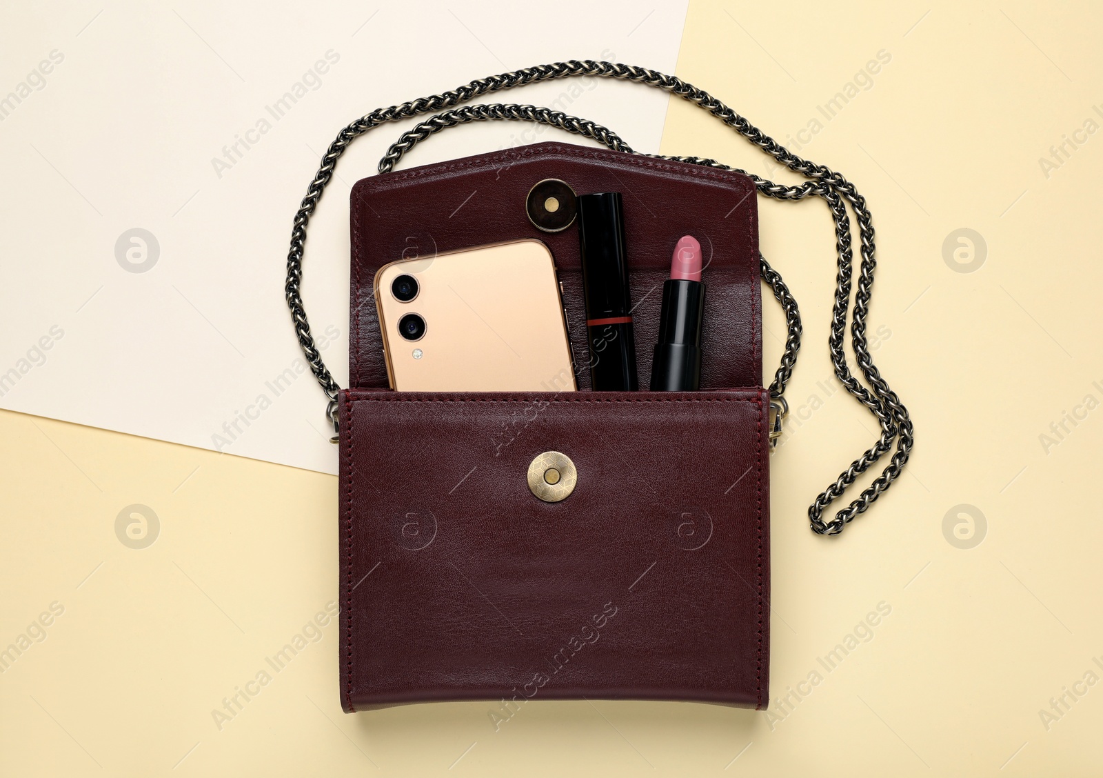 Photo of Flat lay composition with stylish woman's bag on color background