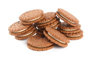 Photo of Tasty chocolate sandwich cookies with cream on white background