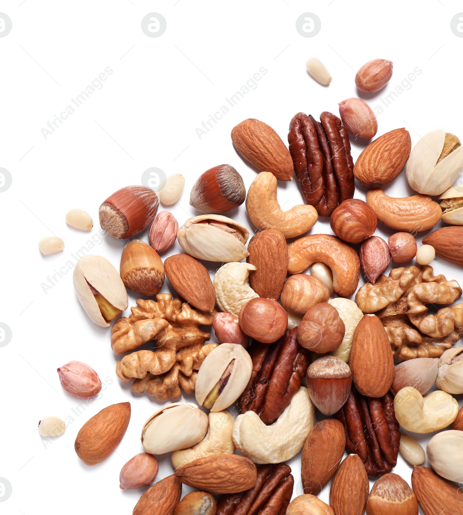 Photo of Different delicious nuts on white background, flat lay. Space for text
