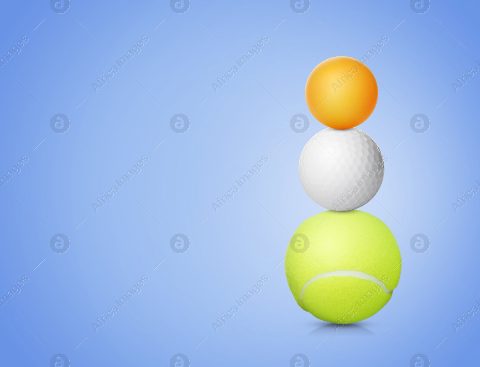 Image of Stack of different sport balls on pale blue background, space for text