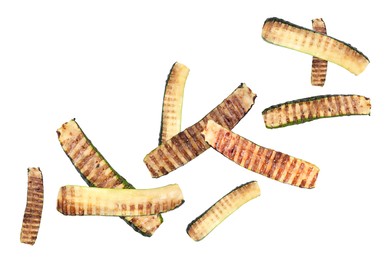 Image of Slices of grilled zucchinis in air on white background