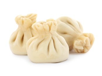 Photo of Boiled dumplings with tasty filling on white background