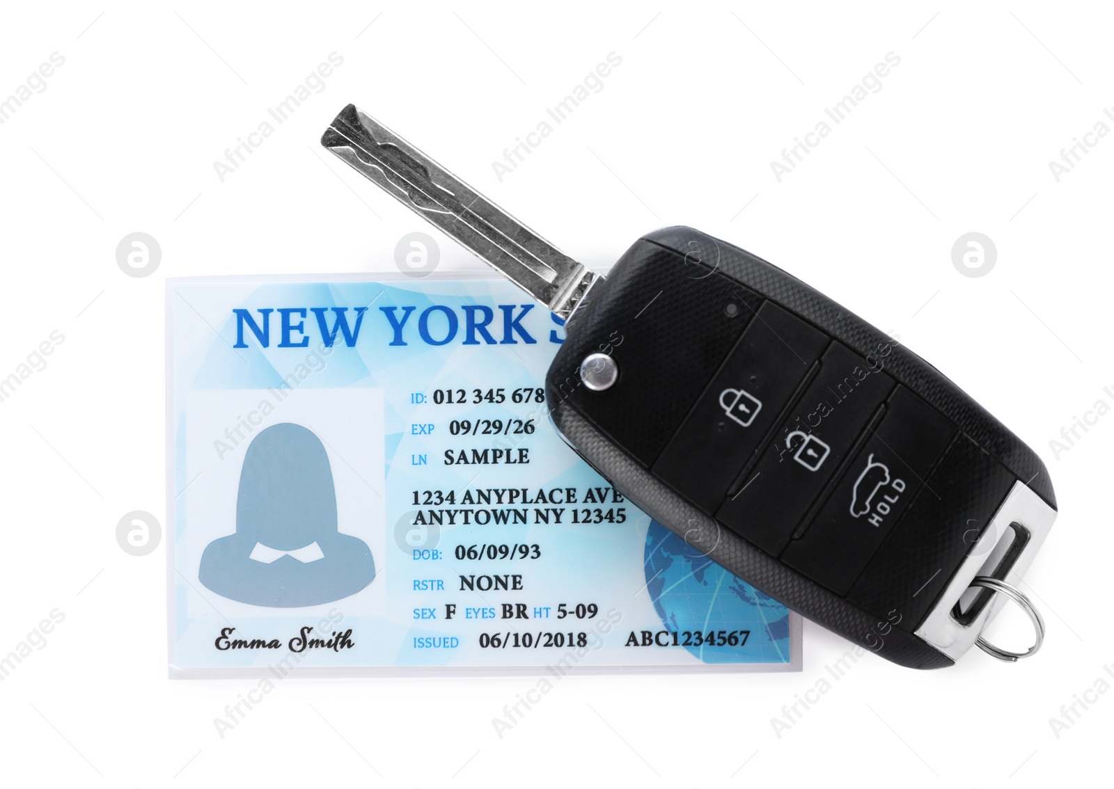 Photo of American driving license and car key on white background, top view