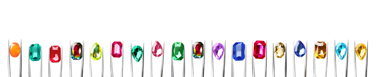 Image of Set of tweezers with different shiny gemstones on white background. Banner design