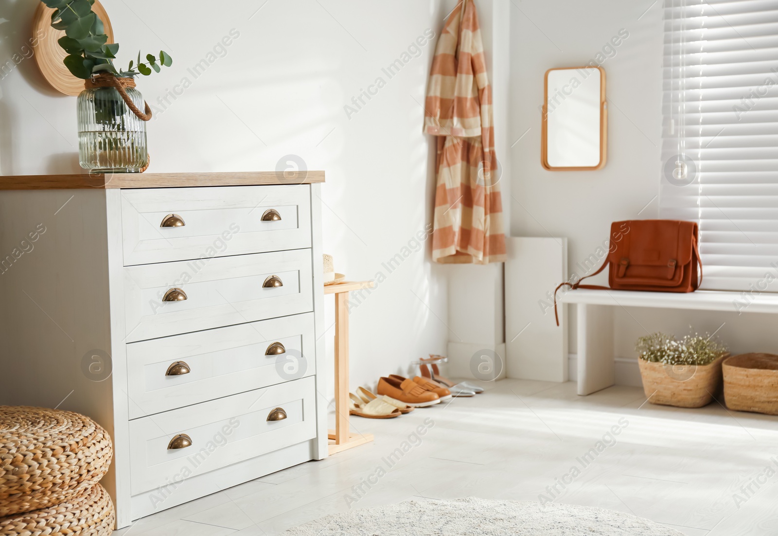 Photo of Chest of drawers in stylish room interior