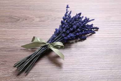 Bouquet of beautiful preserved lavender flowers on wooden table