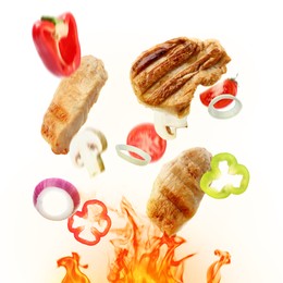 Image of Tasty grilled meat, different vegetables and fire flame on white background