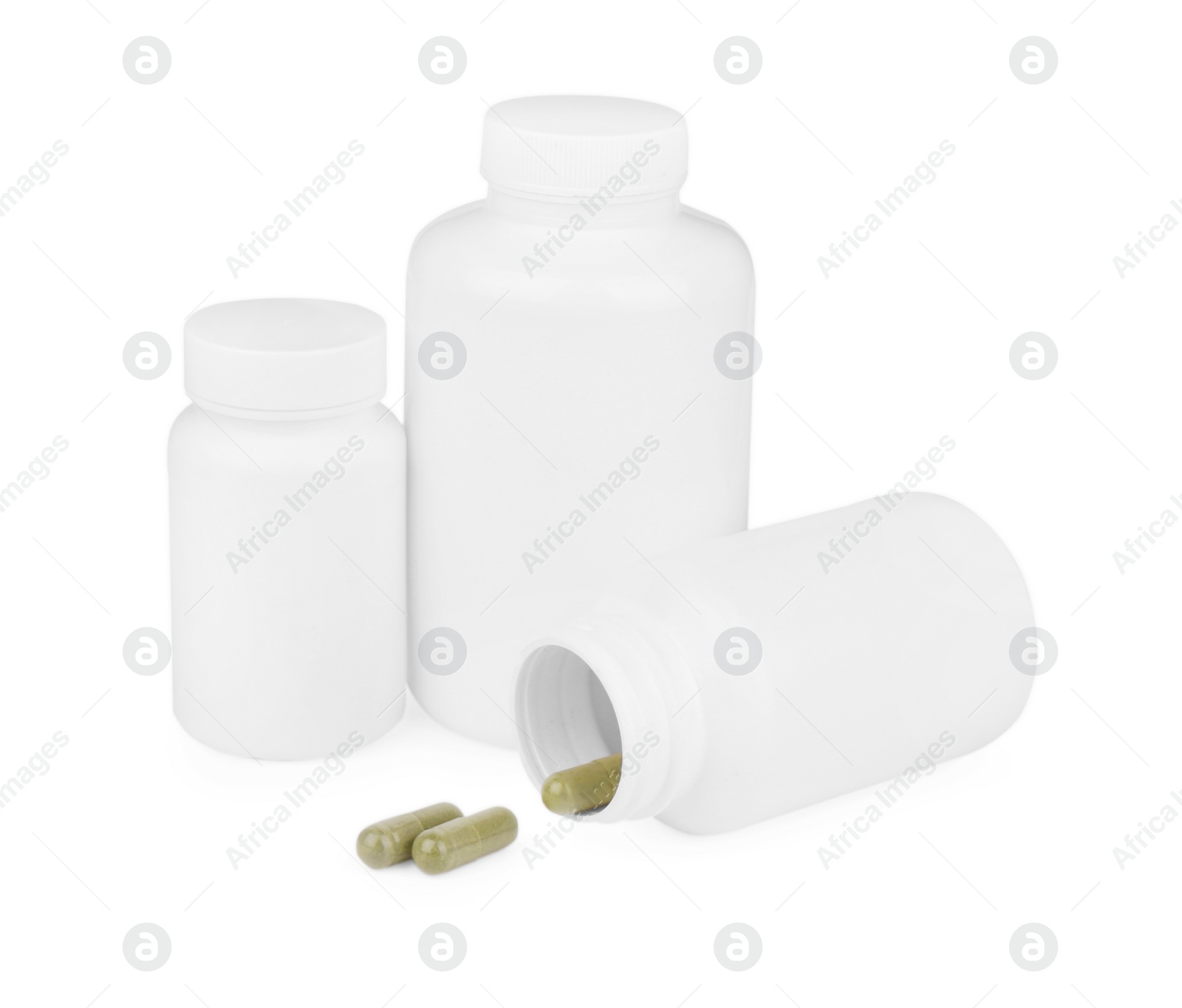 Photo of Vitamin capsules and medical bottles isolated on white