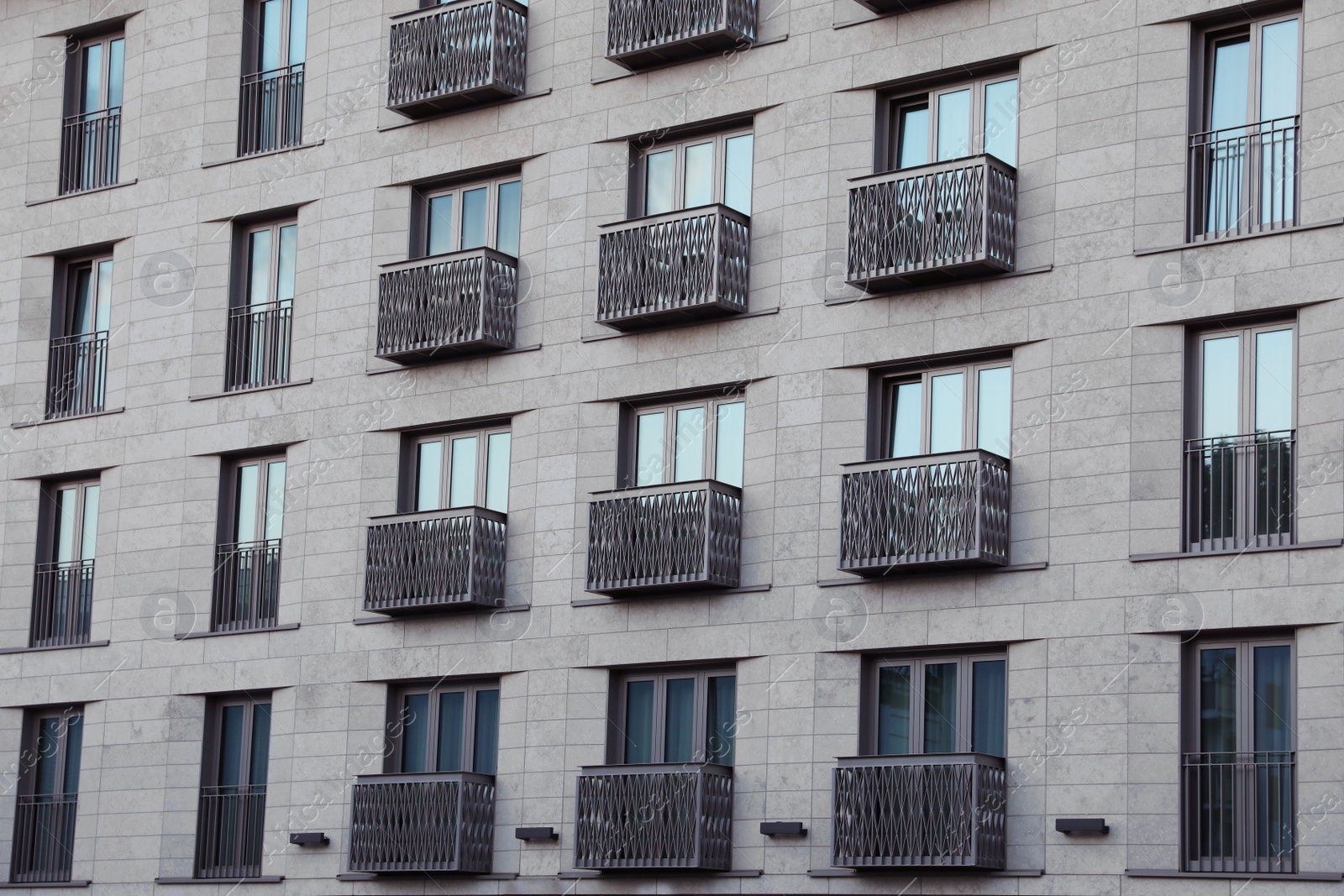 Photo of Beautiful view of modern building with big windows outdoors