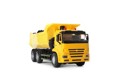 Photo of Yellow toy tipper truck with coal isolated on white