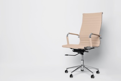 Comfortable office chair on white background, space for text