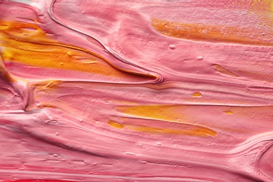 Photo of Bright paint strokes drawn with brush as abstract background