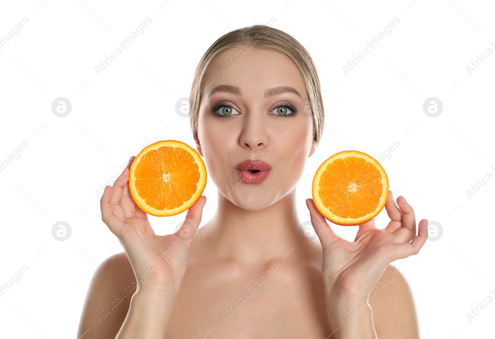 Photo of Young woman with cut orange on white background. Vitamin rich food