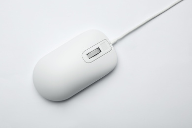 Photo of Wired computer mouse isolated on white, top view