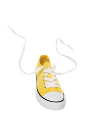Photo of Yellow classic old school sneaker isolated on white