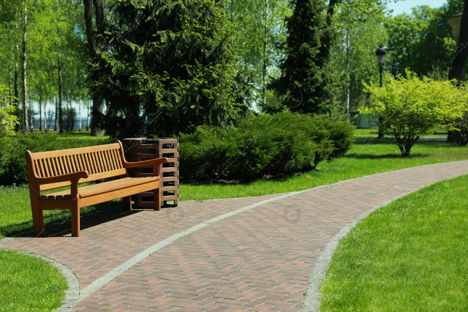 Photo of Picturesque view of beautiful park with fresh green grass and trees