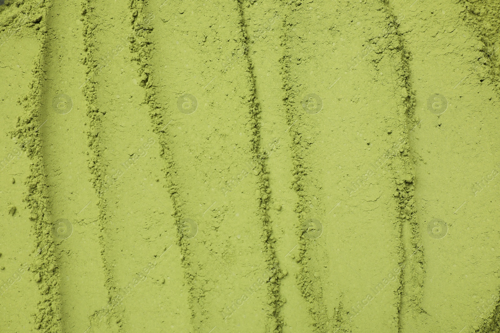 Photo of Green matcha powder as background, top view