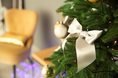 Photo of Christmas tree with stylish decor indoors, closeup