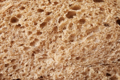 Photo of Fresh bread as background, closeup view. Baked goods