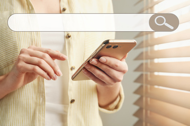 Image of Search bar of internet browser and woman using smartphone indoors, closeup