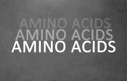 Illustration of Text Amino Acids on grey stone surface