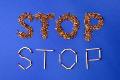 Photo of Words Stop made of dry tobacco and matches on blue background, flat lay. Quitting smoking concept