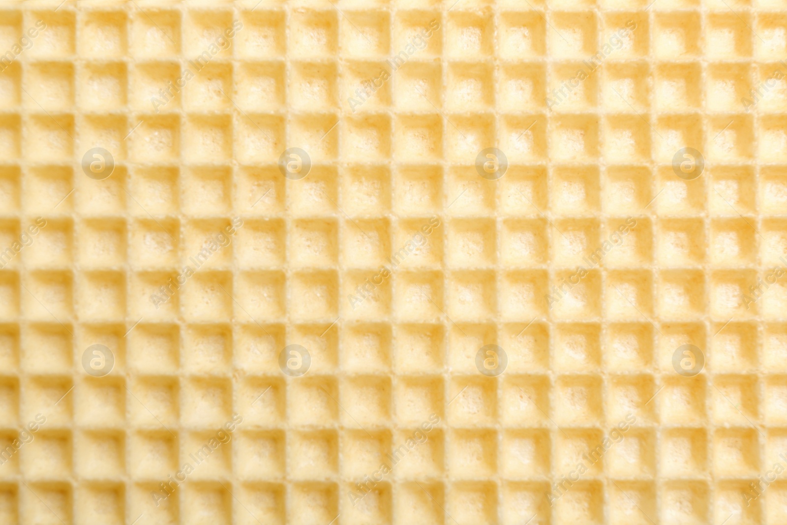 Photo of Tasty wafer as background, closeup. Crispy food
