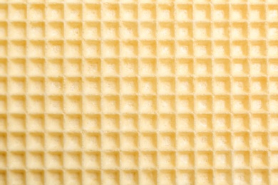 Photo of Tasty wafer as background, closeup. Crispy food