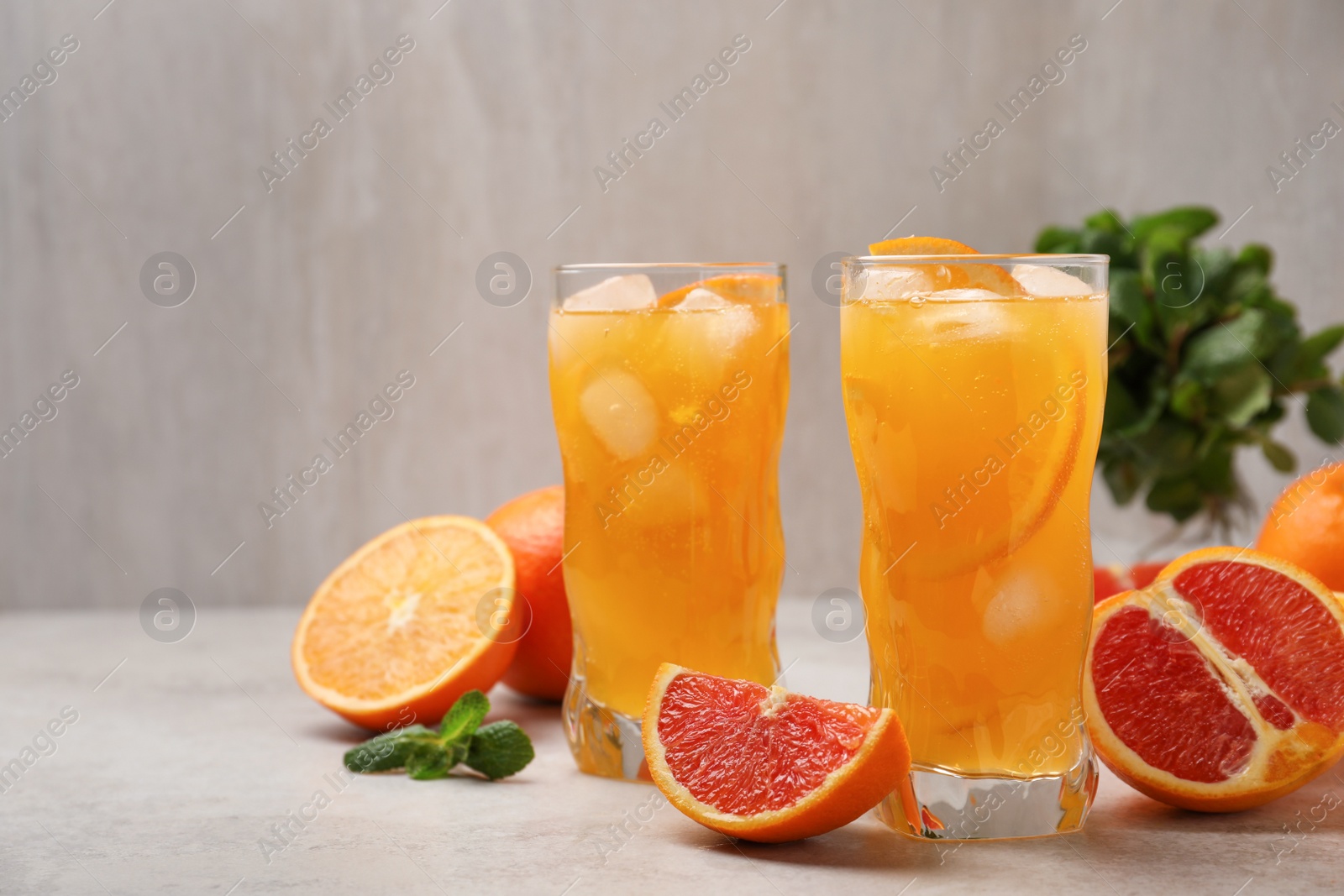 Photo of Delicious orange soda water on light table