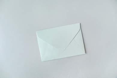 Photo of Paper envelope on light grey background, top view