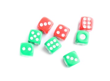 Many green and red game dices isolated on white, top view