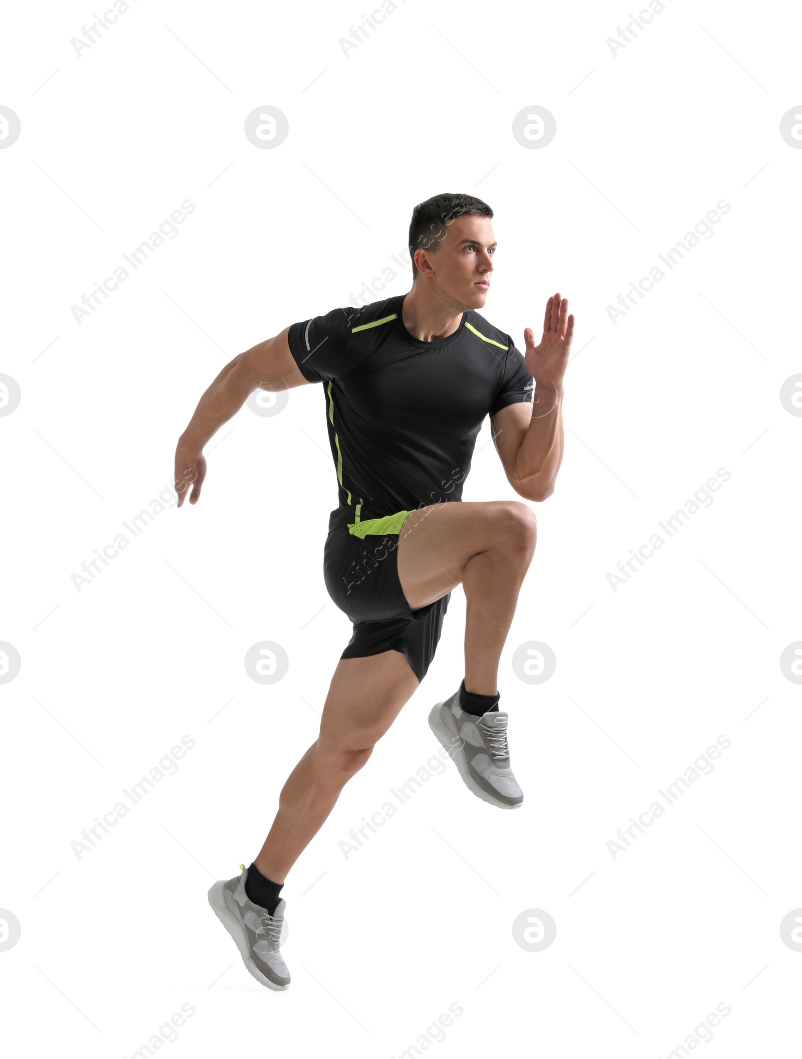 Photo of Athletic young man running on white background