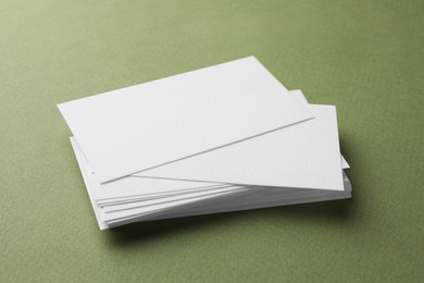 Photo of Blank business cards on khaki background. Mockup for design