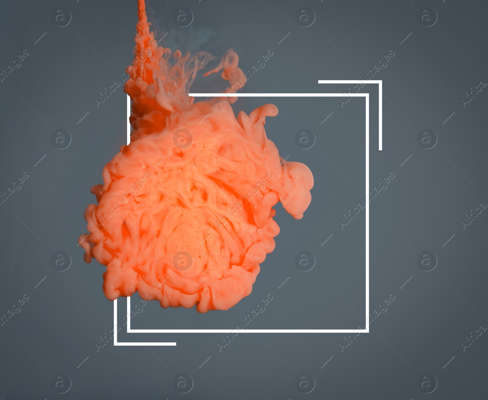 Image of Splash of orange ink and frame on grey background