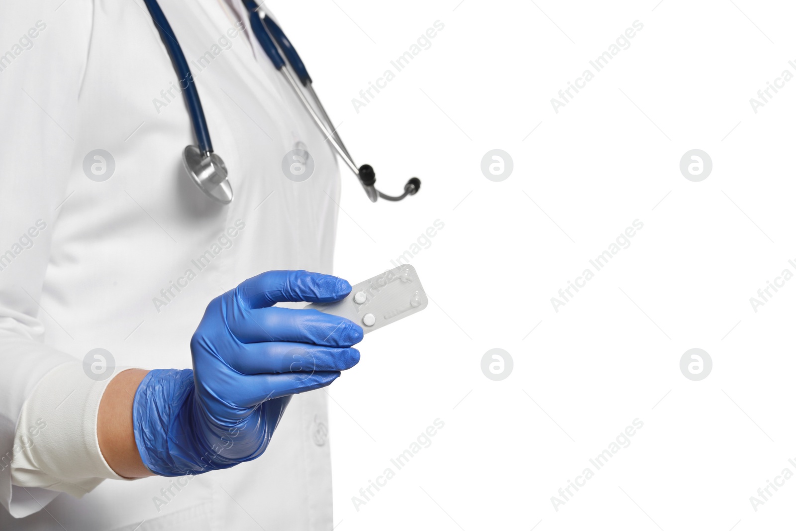 Photo of Doctor holding blister of emergency contraception pills on white background, closeup