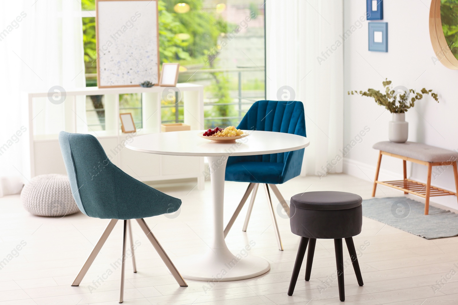 Photo of Modern dining room interior with table and chairs