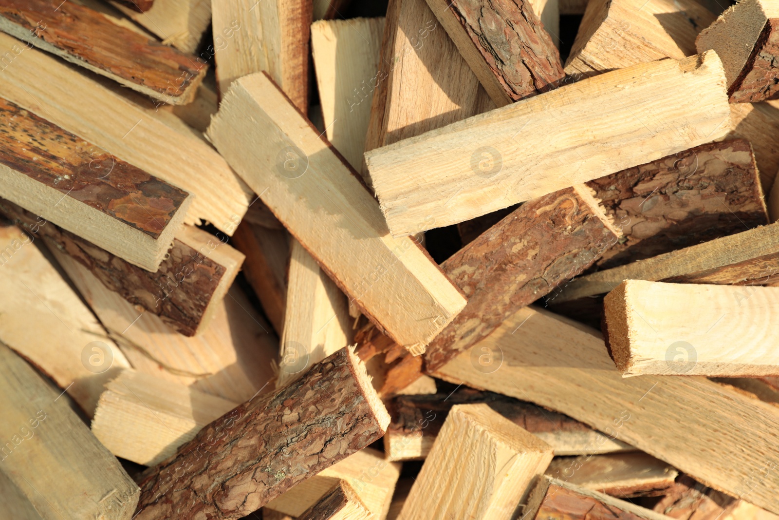 Photo of Pile of cut firewood as background, top view