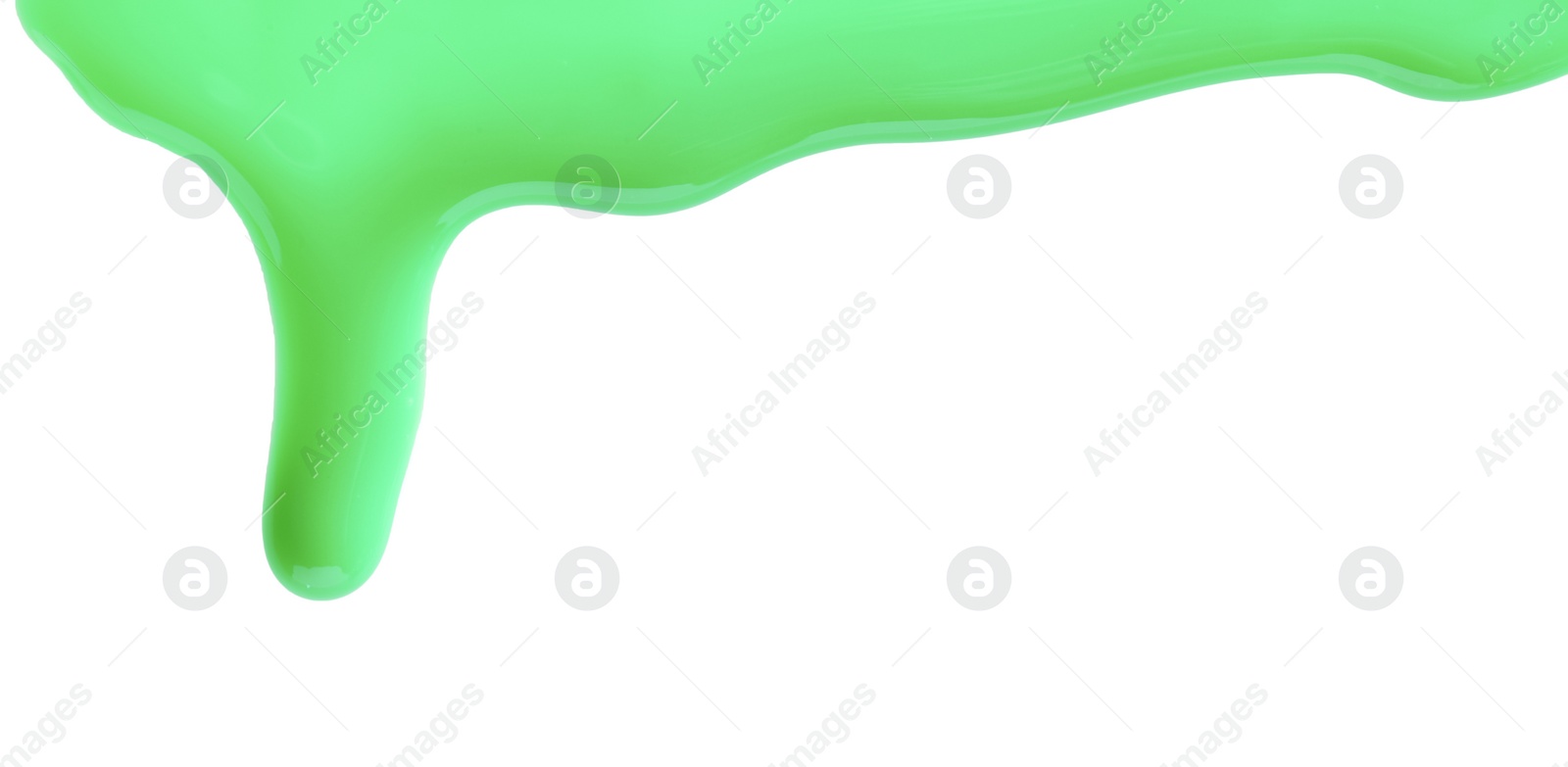 Photo of Green nail polish flowing on white background