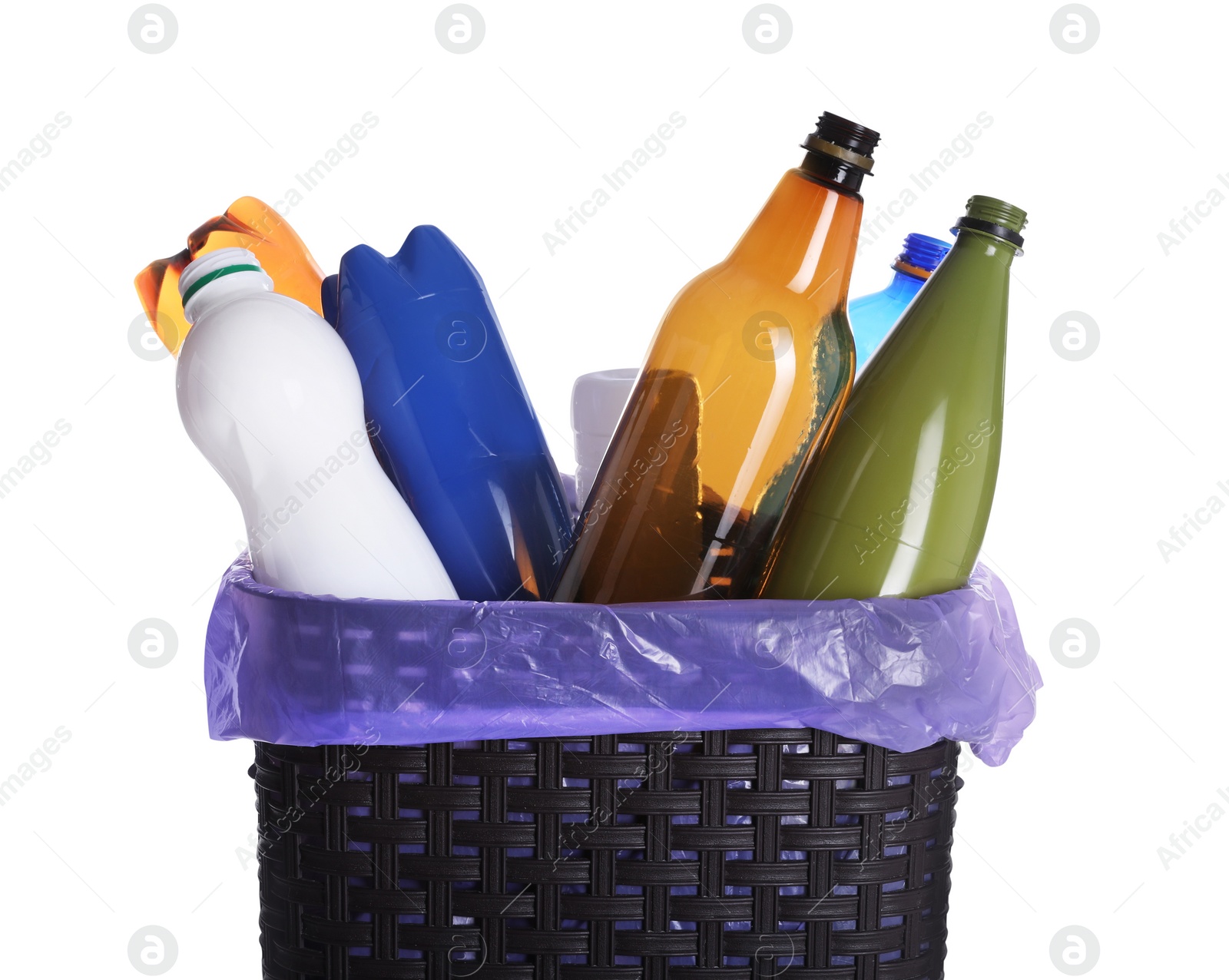 Photo of Trash bin full of plastic bottles on white background, closeup. Recycling rubbish