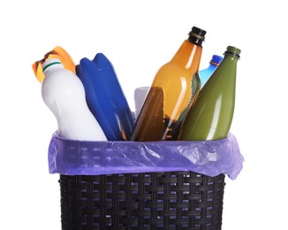 Photo of Trash bin full of plastic bottles on white background, closeup. Recycling rubbish
