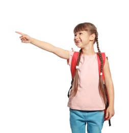 Cute girl with backpack full of school stationery on white background