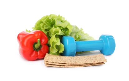 Photo of Healthy diet. Crispbreads, bell pepper, lettuce and dumbbell isolated on white